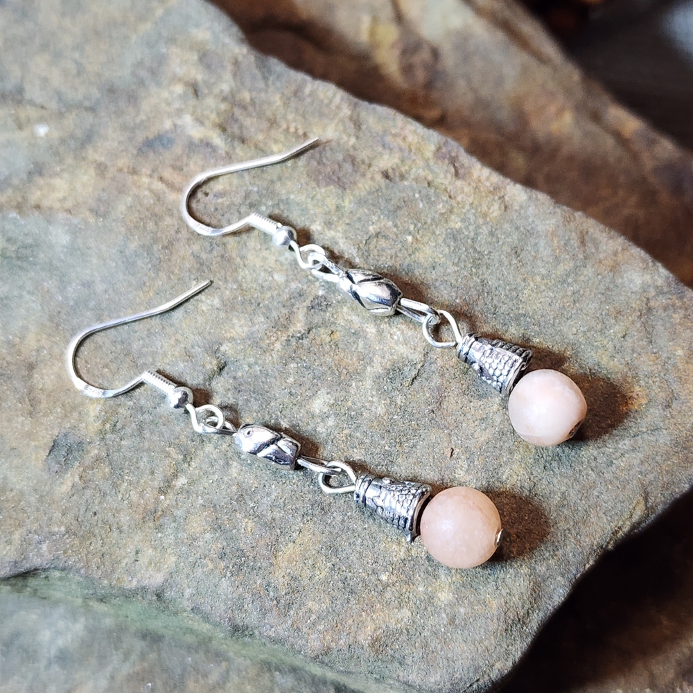 Hand Crafted Dangle Earrings With Etched Silver Tone Accents and Peach Stones